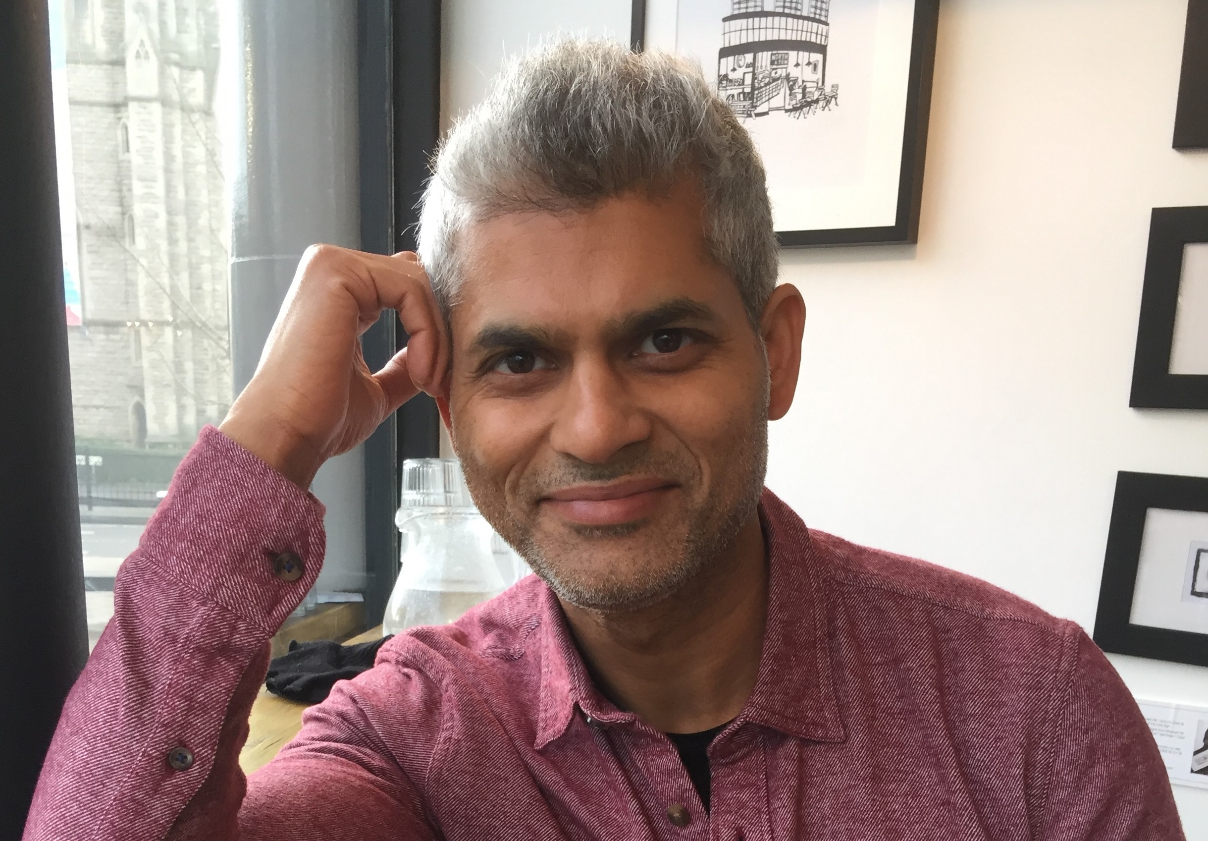 Chetan Jha smiling as he reflects on the Soul's Wisdom