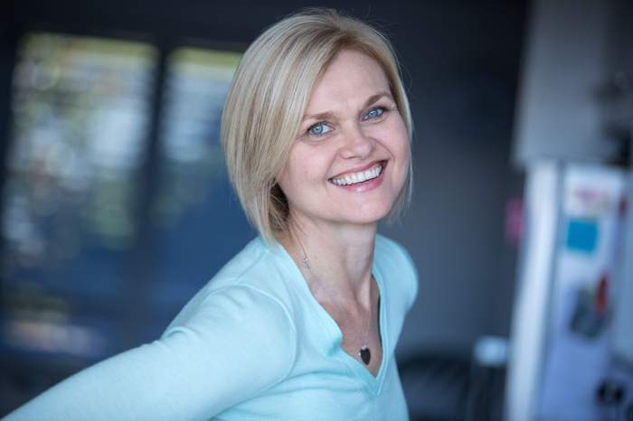 Anna Douglass - woman smiling joyfully